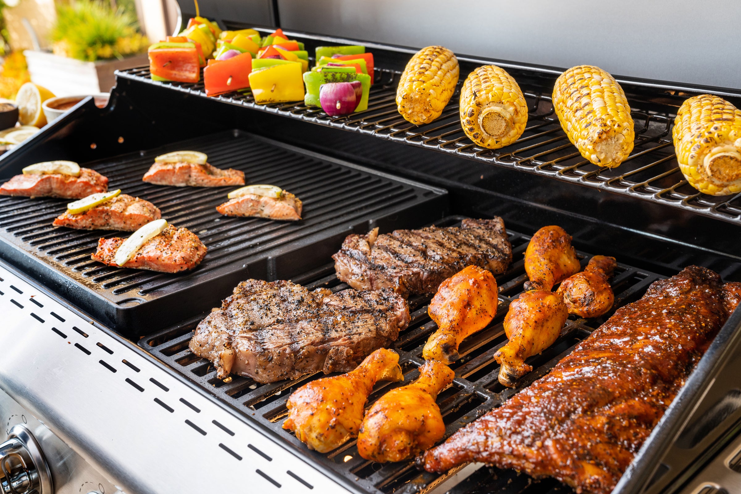 Deluxe 4-Burner Gas Grill - Black with Ceramic Searing Side | Nexgrill